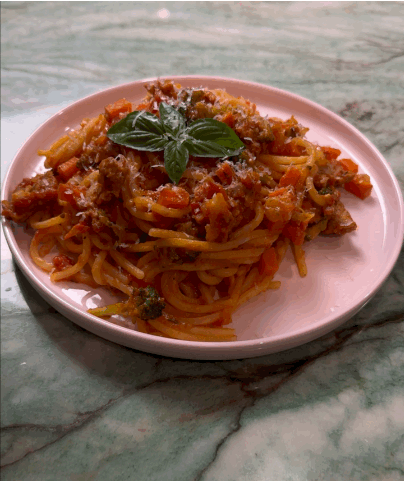 An animated GIF image of Garden Vegetable & Sausage Pasta