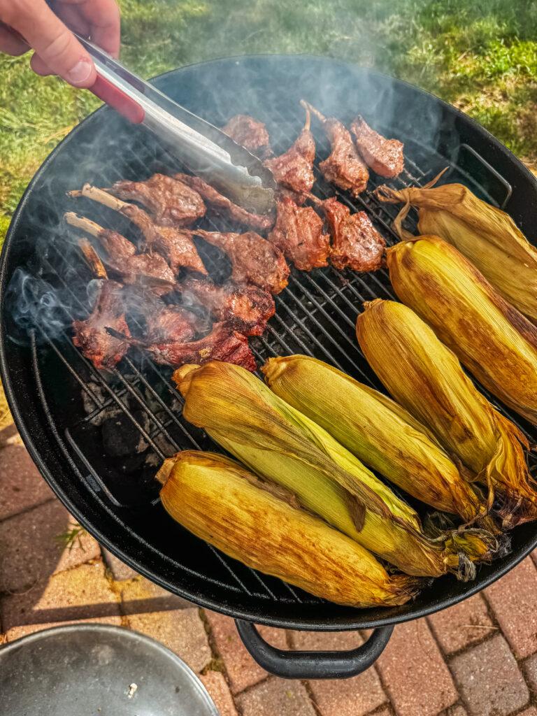 Family cookout with lamb lollipops and corn.  Image by Katherine Rose Woller