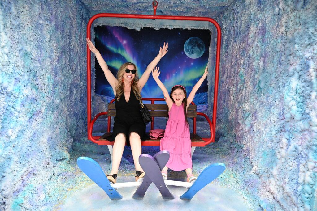 Christianne and Livia having a blast on the interactive art: Space Ski at Area 15.  Image by Dan Sattel