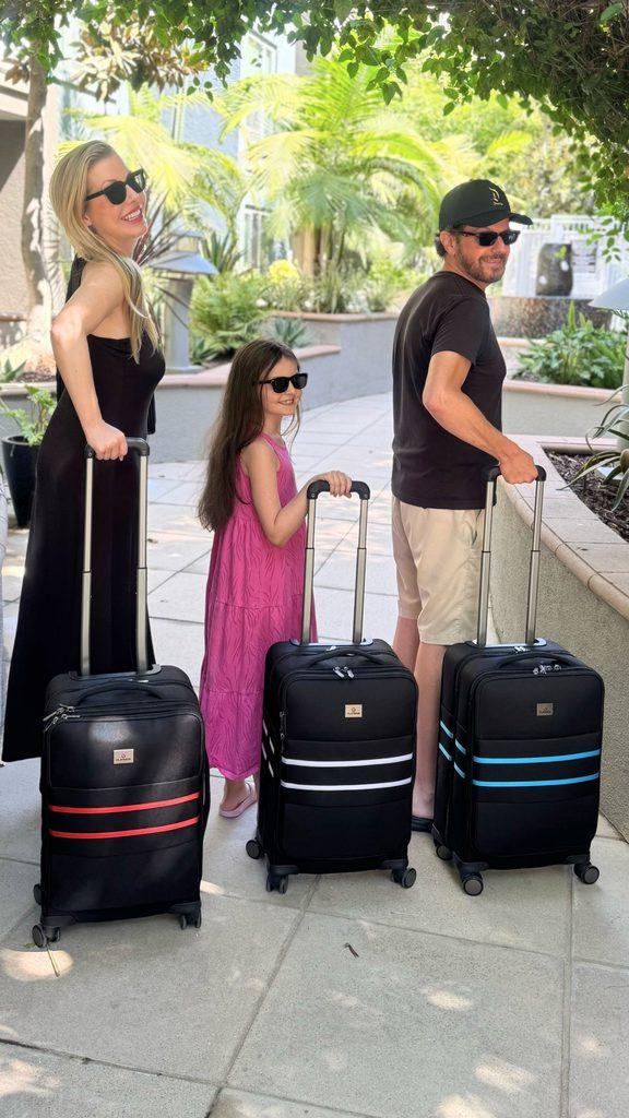 Christianne, Livia, and Dan rolling in to celebrate America's 250th with their Flipside luggage.
