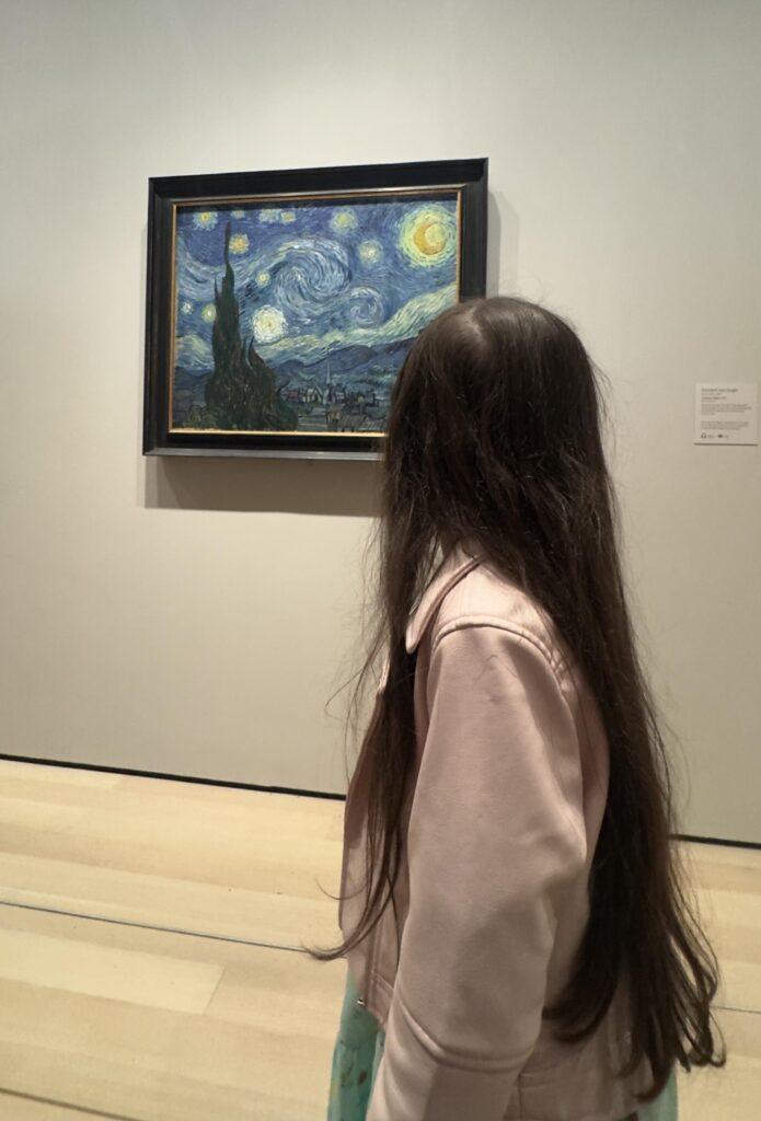 Livia seeing Starry Night by Vincent Van Gogh for the first time.  Image by Christianne Klein