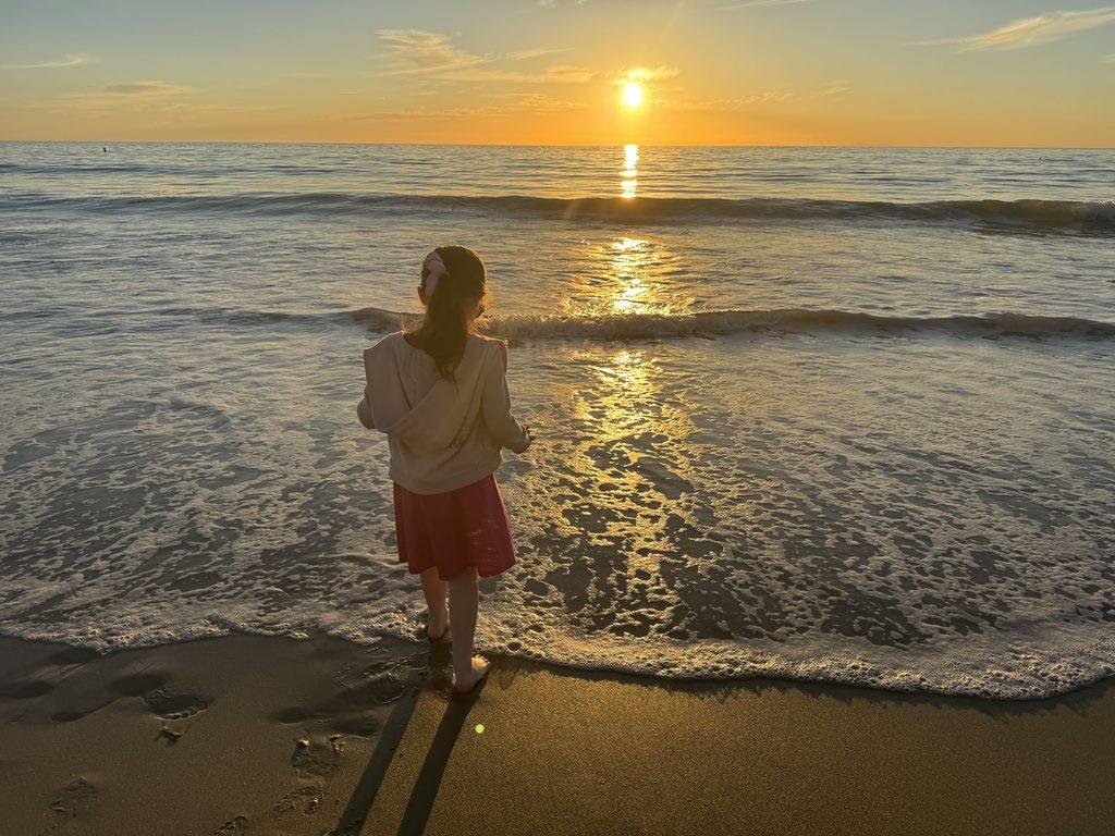 Livia enjoying the beach at sunset. Image by Christianne Klein